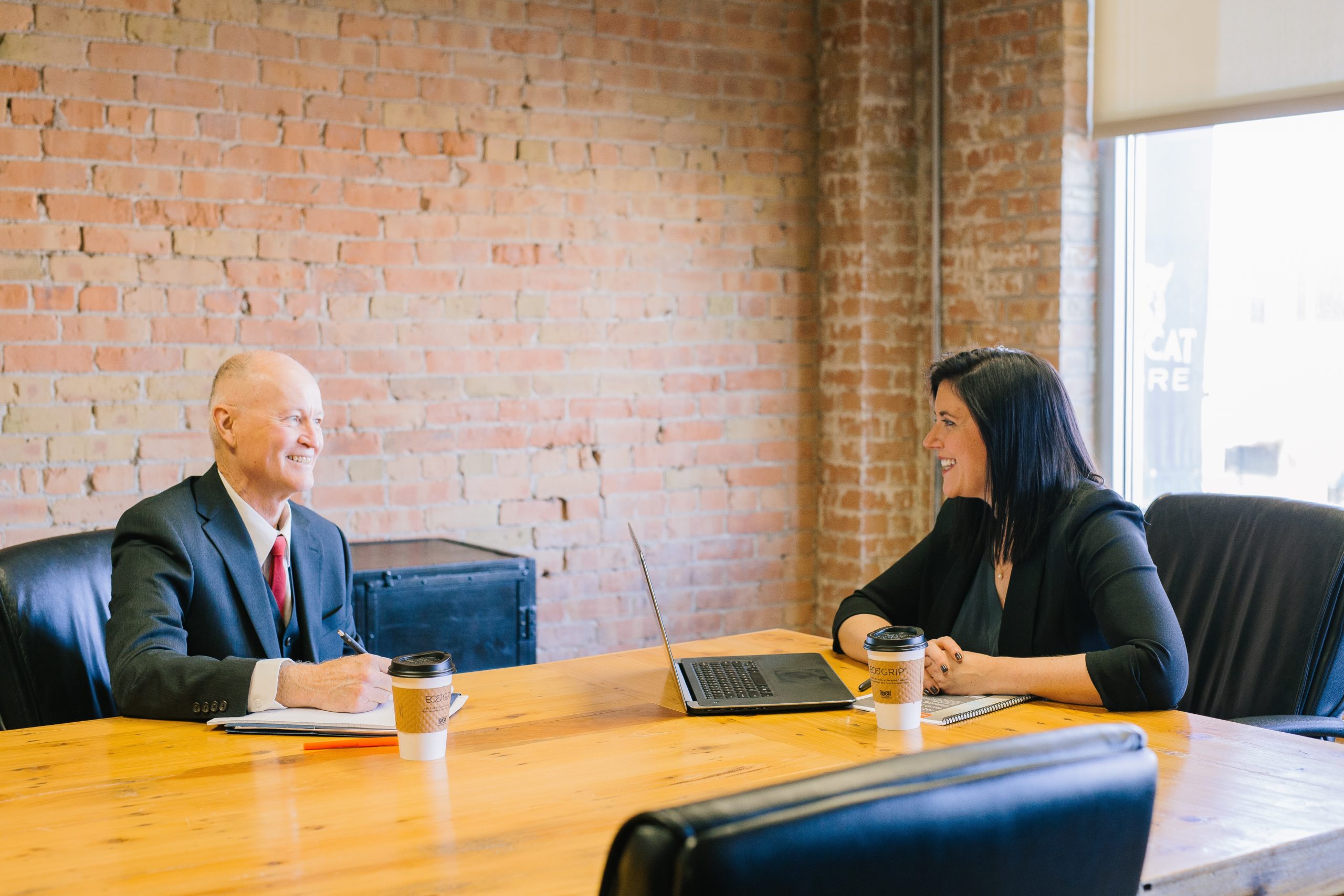 coworkers talking at a conference table