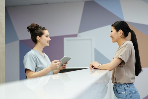 patient checking in at clinic