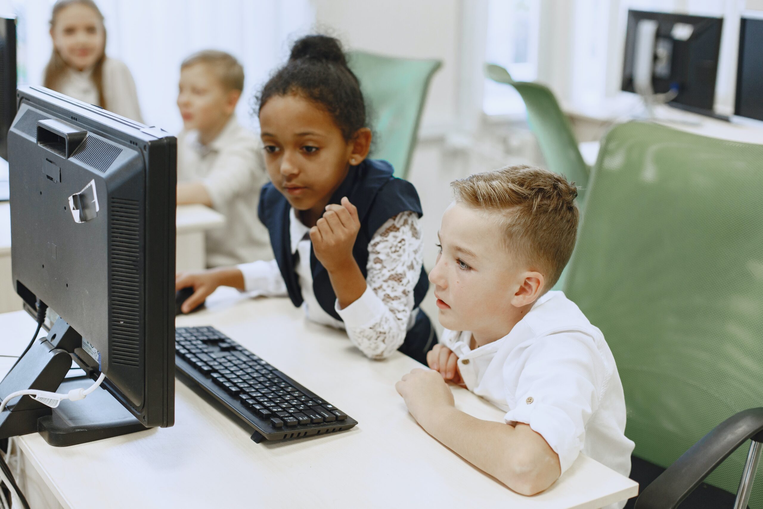Kids sitting in front of a computer