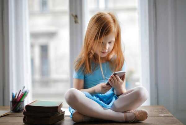 young girl looking at a smartphone