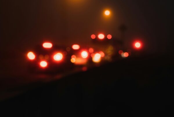 tail lights on cars on a foggy night